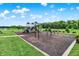 Community playground with various play structures and swings, fostering fun and recreation for residents at 3428 Thomas Jefferson St, Westfield, IN 46074