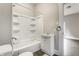 Well-lit bathroom featuring a combination tub and shower with a white vanity at 3652 N Kenwood Ave, Indianapolis, IN 46208