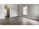 Cozy bedroom with hardwood floors, neutral paint, and natural light creating a comfortable and inviting space at 3652 N Kenwood Ave, Indianapolis, IN 46208
