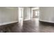 Spacious living room with beautiful flooring, freshly painted walls, and doorways leading to other rooms in the house at 3652 N Kenwood Ave, Indianapolis, IN 46208