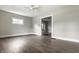 Inviting living room featuring gray walls, white trim and modern flooring at 3652 N Kenwood Ave, Indianapolis, IN 46208