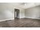 Open-concept living space featuring new floors, neutral gray walls and an open doorway at 3652 N Kenwood Ave, Indianapolis, IN 46208