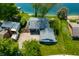 Aerial view of the home, showcasing the lake access and well-maintained lawn with mature trees at 3701 Sandy Hook Dr, Columbus, IN 47203