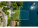 Stunning aerial view of lakefront property with mature trees and ample shoreline at 3701 Sandy Hook Dr, Columbus, IN 47203
