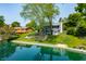 This home offers stunning waterfront living with mature trees and impeccable landscaping at 3701 Sandy Hook Dr, Columbus, IN 47203