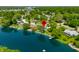 Aerial photograph of a house by the lake, with a pin showing the property's location at 3701 Sandy Hook Dr, Columbus, IN 47203