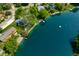 Aerial view of a lakefront property showing the house, private beach, and lake access at 3701 Sandy Hook Dr, Columbus, IN 47203