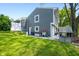 Exterior of a home with a backyard featuring a green lawn and play structure at 3701 Sandy Hook Dr, Columbus, IN 47203