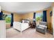 Cozy bedroom with natural light, a comfy chair, and well-placed decor at 3701 Sandy Hook Dr, Columbus, IN 47203