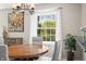 Dining table near a window, creating a bright and inviting atmosphere for meals and gatherings at 3701 Sandy Hook Dr, Columbus, IN 47203