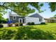 Well-maintained home featuring a blend of brick and siding and a lush, green lawn at 3701 Sandy Hook Dr, Columbus, IN 47203