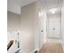 Upstairs hallway featuring neutral colored carpet, neutral walls, and white trim at 3701 Sandy Hook Dr, Columbus, IN 47203