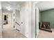 Upstairs hallway featuring neutral colored carpet, neutral walls, and white doors at 3701 Sandy Hook Dr, Columbus, IN 47203