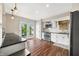 Bright eat-in kitchen featuring granite counters, modern appliances, and french doors to the backyard at 3701 Sandy Hook Dr, Columbus, IN 47203