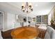 Open living room with wood floors, stylish lighting, built-in bookshelf and fireplace at 3701 Sandy Hook Dr, Columbus, IN 47203