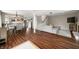 Expansive living area open to the kitchen and dining, featuring hardwood floors and neutral decor at 3701 Sandy Hook Dr, Columbus, IN 47203