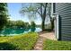 Picturesque waterfront view with mature trees, lush greenery, and serene water at 3701 Sandy Hook Dr, Columbus, IN 47203