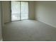 Bright bedroom featuring neutral carpet, light walls and a sliding glass door at 4486 Abby Creek Ln, Indianapolis, IN 46205