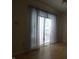 Bright living room with attractive curtains, blinds, and sliding glass doors at 4486 Abby Creek Ln, Indianapolis, IN 46205