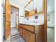 Classic bathroom features a double vanity, framed mirror, and wood cabinets at 4733 E 100 S, Anderson, IN 46017