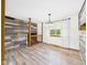 Dining area featuring modern flooring, wood trim, and a view of the backyard at 4733 E 100 S, Anderson, IN 46017