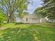 Detached garage with a lawn, perfect for parking and outdoor storage at 4733 E 100 S, Anderson, IN 46017