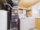 Functional laundry area with appliances, storage, and a window for natural light at 4733 E 100 S, Anderson, IN 46017