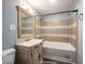 Bathroom with a vanity, toilet and combination tub and shower at 5050 W Regent St, Indianapolis, IN 46241
