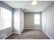 Bedroom featuring two windows, neutral carpet and paint at 5050 W Regent St, Indianapolis, IN 46241