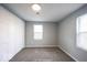 Neutral bedroom with a large closet and two bright windows at 5050 W Regent St, Indianapolis, IN 46241