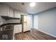 Inviting kitchen with white cabinets, wood-look vinyl flooring, and ample counter space at 5050 W Regent St, Indianapolis, IN 46241