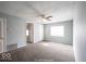 Bright living room featuring carpet flooring, fresh paint, and a ceiling fan at 5050 W Regent St, Indianapolis, IN 46241