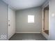 Mud room entry area featuring a window and access to the exterior and interior at 5050 W Regent St, Indianapolis, IN 46241