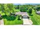 An aerial shot of a beautiful home with an expansive lawn and mature trees in a quiet neighborhood at 5215 Limestone Ct, Indianapolis, IN 46237
