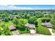 An aerial perspective of a home nestled in a serene neighborhood with mature trees and green spaces at 5215 Limestone Ct, Indianapolis, IN 46237