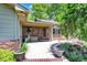 Charming brick back porch and garden are perfect for relaxing in the fresh air at 5215 Limestone Ct, Indianapolis, IN 46237