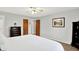 Bedroom with two wooden doors, dresser and decor at 5215 Limestone Ct, Indianapolis, IN 46237