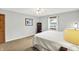 Bright bedroom featuring a ceiling fan and view from the window at 5215 Limestone Ct, Indianapolis, IN 46237