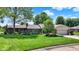 Charming single-story brick home with well-manicured lawn, mature trees, and a two-car garage in a suburban setting at 5215 Limestone Ct, Indianapolis, IN 46237