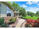 Landscaped front yard with brick walkway leads to a charming home entrance at 5215 Limestone Ct, Indianapolis, IN 46237