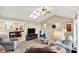 Open concept living area with vaulted ceilings, skylight, and seamless flow to the kitchen at 5215 Limestone Ct, Indianapolis, IN 46237