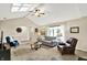 Bright living room boasts vaulted ceilings, skylights and neutral décor at 5215 Limestone Ct, Indianapolis, IN 46237