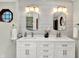 A bright primary bath features double sinks with modern fixtures and attractive decor at 5215 Limestone Ct, Indianapolis, IN 46237