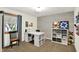 Craft room featuring a white desk, storage and nice natural light at 5215 Limestone Ct, Indianapolis, IN 46237