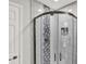 Close up of the glass shower with gray tile and silver hardware at 5215 Limestone Ct, Indianapolis, IN 46237
