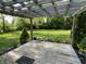 Relaxing backyard patio with pergola, overlooking a spacious lawn with manicured landscaping at 526 Emerson Rd, Carmel, IN 46032