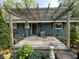 Inviting backyard showcasing a wooden pergola, a wooden deck and tasteful landscaping at 526 Emerson Rd, Carmel, IN 46032
