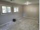 Carpeted bedroom featuring dual windows, neutral walls, and space for furniture creates a relaxing retreat at 526 Emerson Rd, Carmel, IN 46032