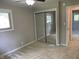 Cozy bedroom featuring soft carpet, a mirrored closet, and natural light from a window at 526 Emerson Rd, Carmel, IN 46032
