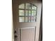 Stylish front door with decorative glass panels and updated hardware offers curb appeal at 526 Emerson Rd, Carmel, IN 46032